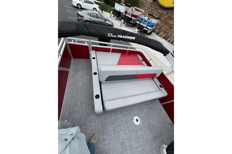 Slide: The Image of 2026 Sun Tracker Party Barge 22 RF DLX pontoon boat interior with seating and canopy. - 6