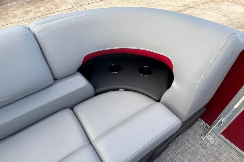 Slide: The Image of 2026 Sun Tracker Party Barge 22 RF DLX seating with cup holders, gray upholstery. - 14