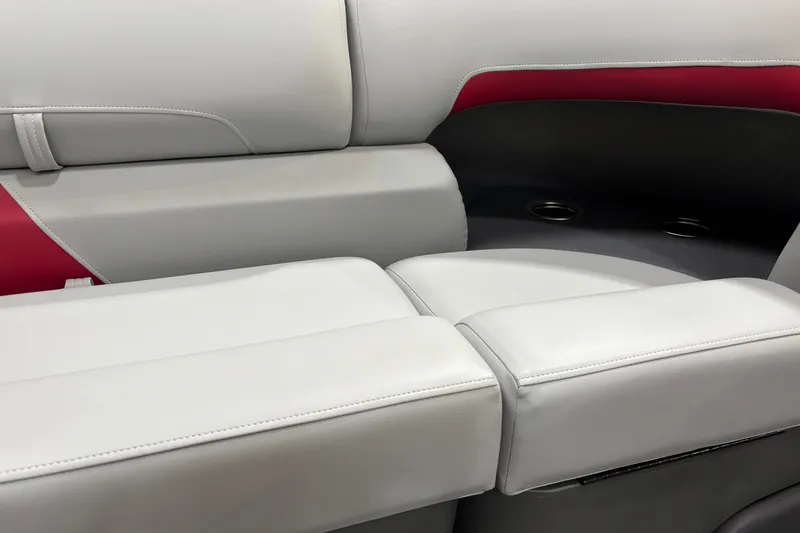 Slide: The Image of 2026 Sun Tracker Party Barge 22 RF DLX interior seating with white and red upholstery. - 16