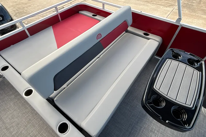 Slide: The Image of 2026 Sun Tracker Party Barge 22 RF DLX interior with seating and cup holders. - 26