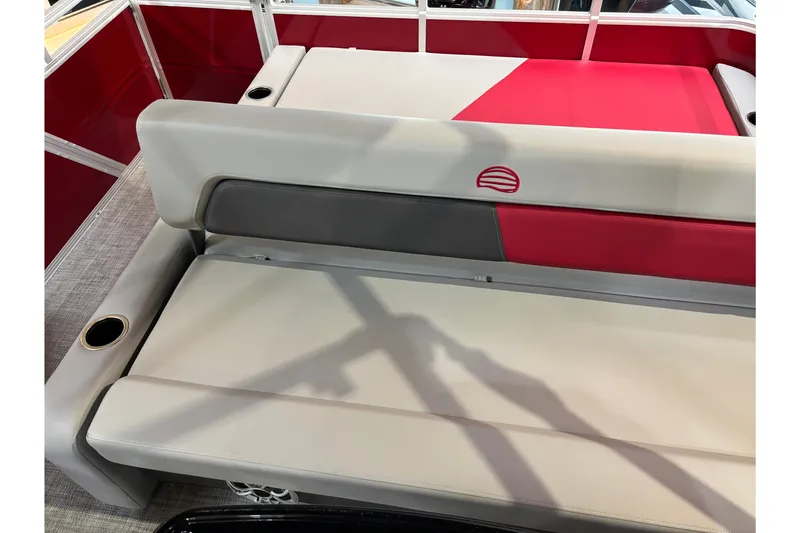 Slide: The Image of 2026 Sun Tracker Party Barge 22 RF DLX seating with red and beige upholstery. - 24