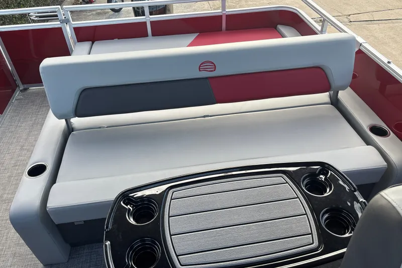Slide: The Image of 2026 Sun Tracker Party Barge 22 RF DLX interior with seating and cup holders. - 25