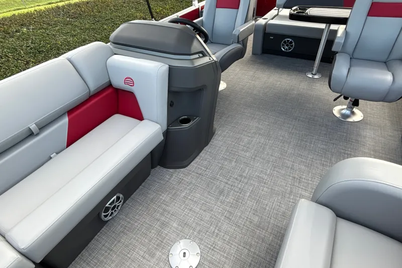 Slide: The Image of 2026 Sun Tracker Party Barge 22 RF DLX interior with gray and red seating. - 29