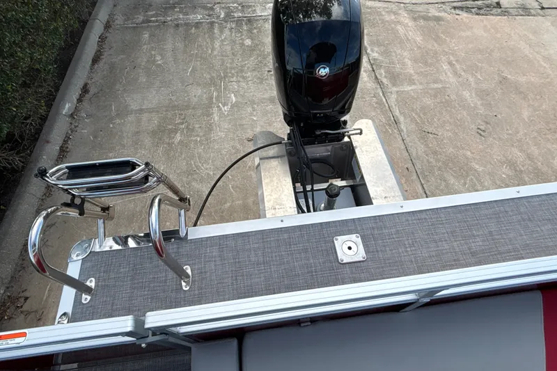 Slide: The Image of 2026 Sun Tracker Party Barge 22 RF DLX with outboard motor and swim ladder. - 42