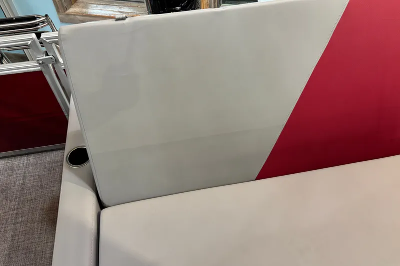 Slide: The Image of 2026 Sun Tracker Party Barge 22 RF DLX seating with red and white upholstery. - 27