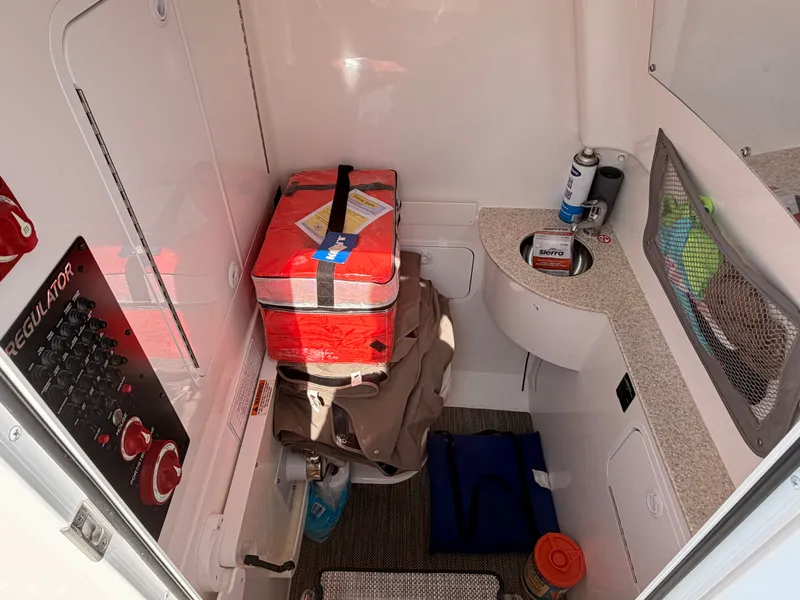 Slide: The Image of Interior of a 2022 Regulator 28 boat with storage and equipment. - 13