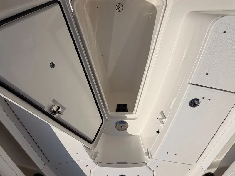 Slide: The Image of Interior view of a 2022 Regulator 28 boat storage compartment. - 15