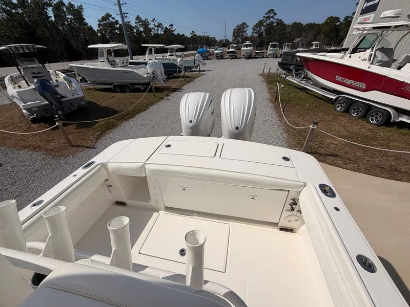 Slide: The Image of 2022 Regulator 28 boat on a lot with other boats. - 18