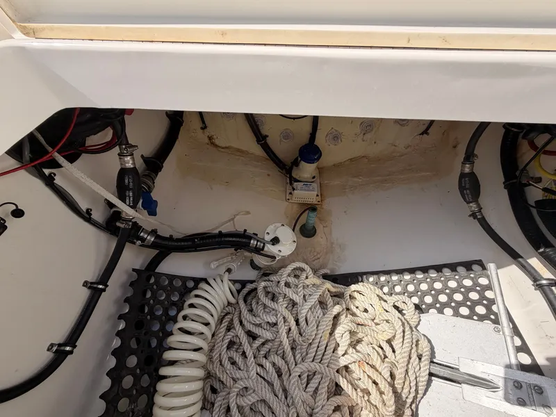 Slide: The Image of Interior of a 2022 Regulator 28 boat with ropes and hoses. - 19