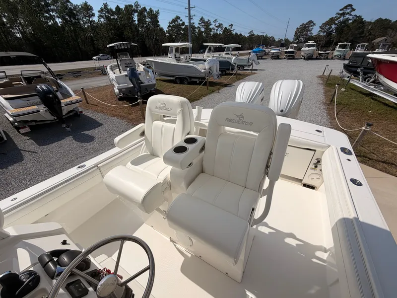 Slide: The Image of Interior view of a 2022 Regulator 28 boat with white seats. - 20