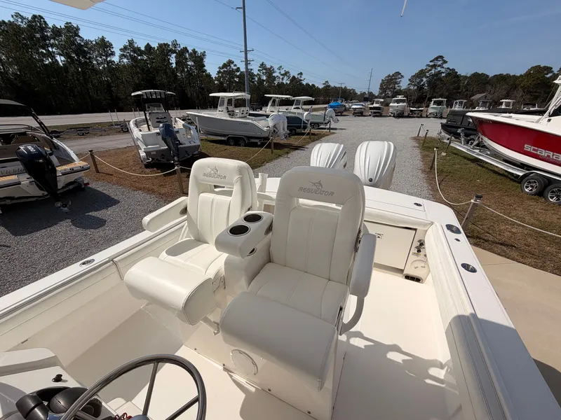 Slide: The Image of 2022 Regulator 28 boat with luxurious outdoor seating. - 21