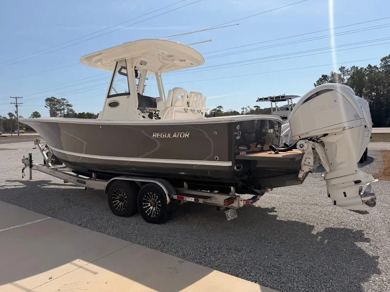 Slide: The Image of 2022 Regulator 28 boat on trailer with Yamaha engine. - 4