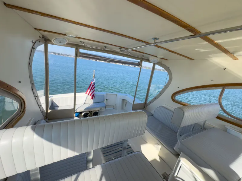 Slide: The Image of Interior of a 2004 Mainship Pilot 34 yacht overlooking the water. - 12