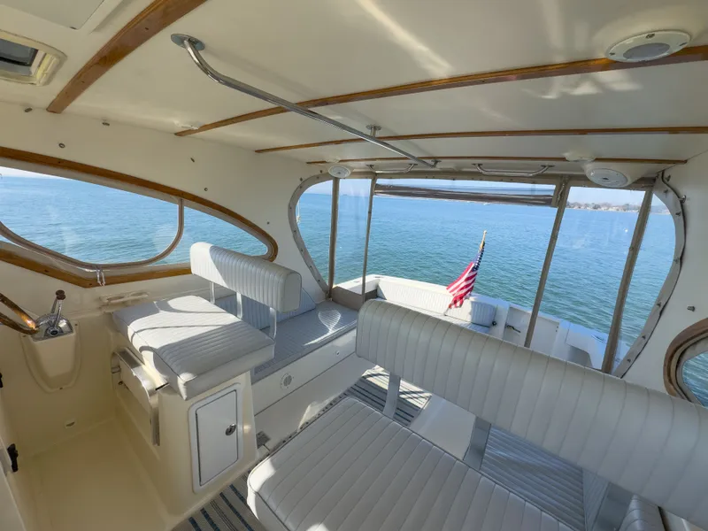 Slide: The Image of Interior of a 2004 Mainship Pilot 34 yacht on the water. - 13