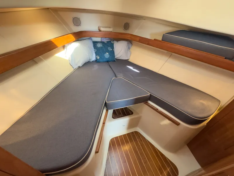 Slide: The Image of Interior of 2004 Mainship Pilot 34 yacht with cozy sleeping cabin. - 14