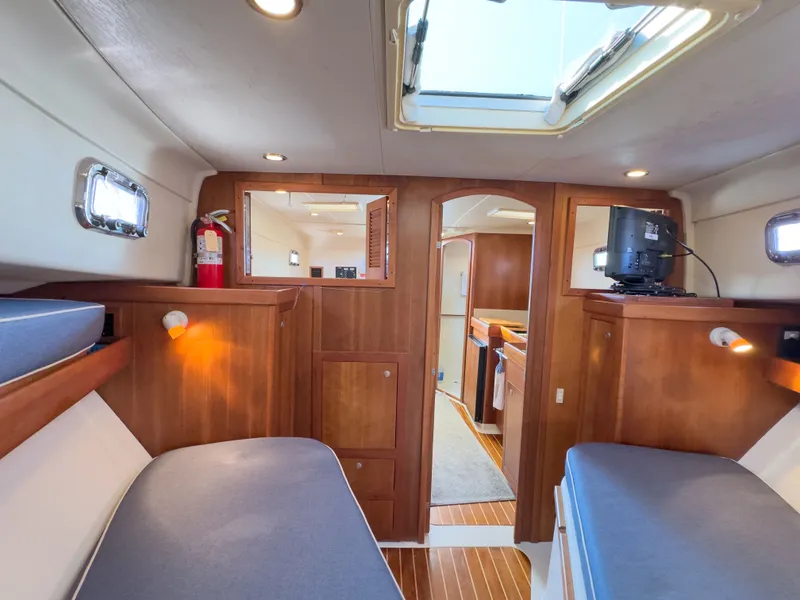 Slide: The Image of Interior of a 2004 Mainship Pilot 34 yacht with wood finish. - 18