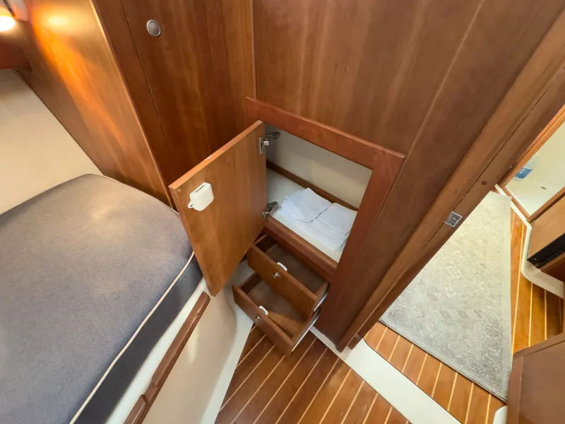 Slide: The Image of Interior of 2004 Mainship Pilot 34 with wooden cabinets. - 19
