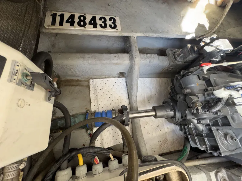 Slide: The Image of Engine room of a 2004 Mainship Pilot 34 with serial number. - 36