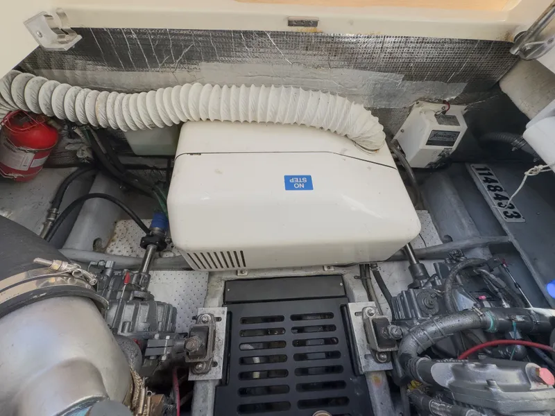 Slide: The Image of Engine compartment of a 2004 Mainship Pilot 34 boat with generator. - 38