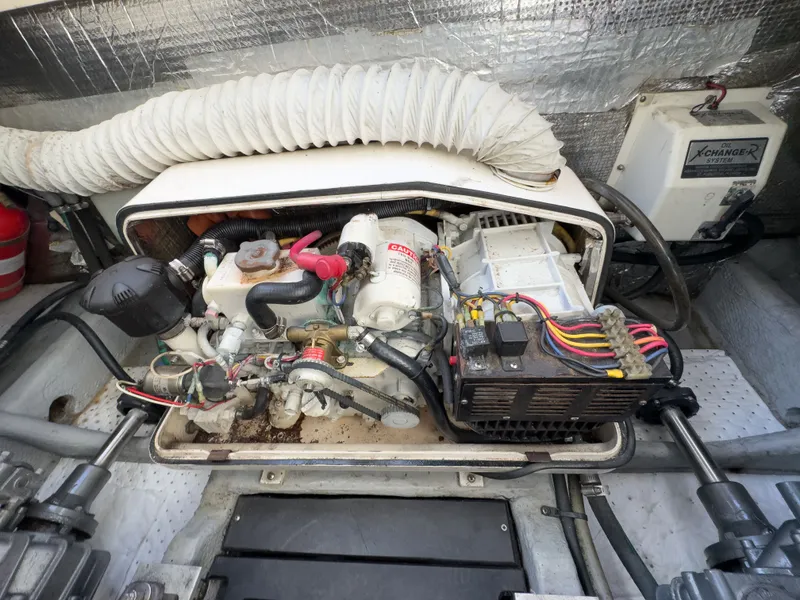 Slide: The Image of Engine compartment of a 2004 Mainship Pilot 34 with wiring. - 39