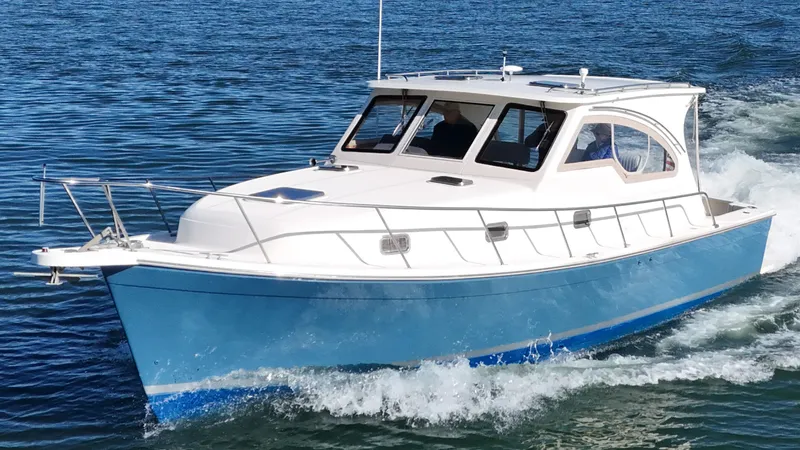 Slide: The Image of 2004 Mainship Pilot 34 boat cruising on calm waters. - 49