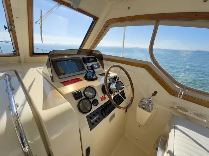 Slide: The Image of 2004 Mainship Pilot 34 helm with ocean view. - 9