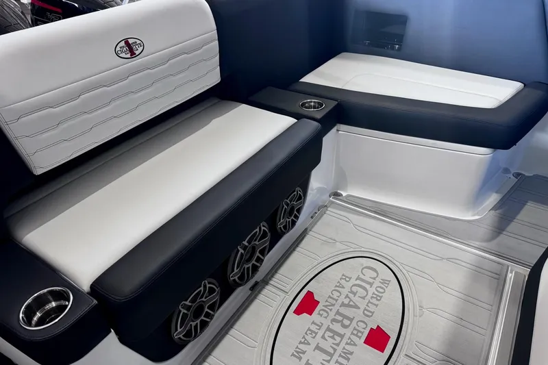 Slide: The Image of Interior of 2025 Cigarette 42' Auroris boat with sleek seating and branded floor mat. - 12