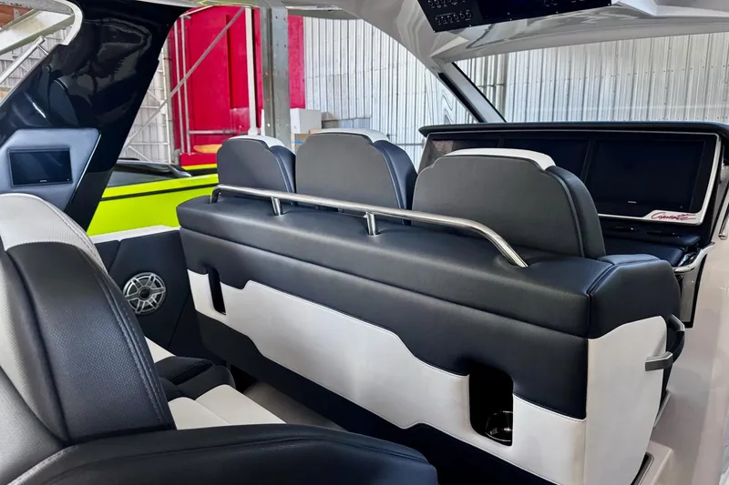Slide: The Image of Interior of 2025 Cigarette 42' Auroris boat with sleek black and white seating. - 14