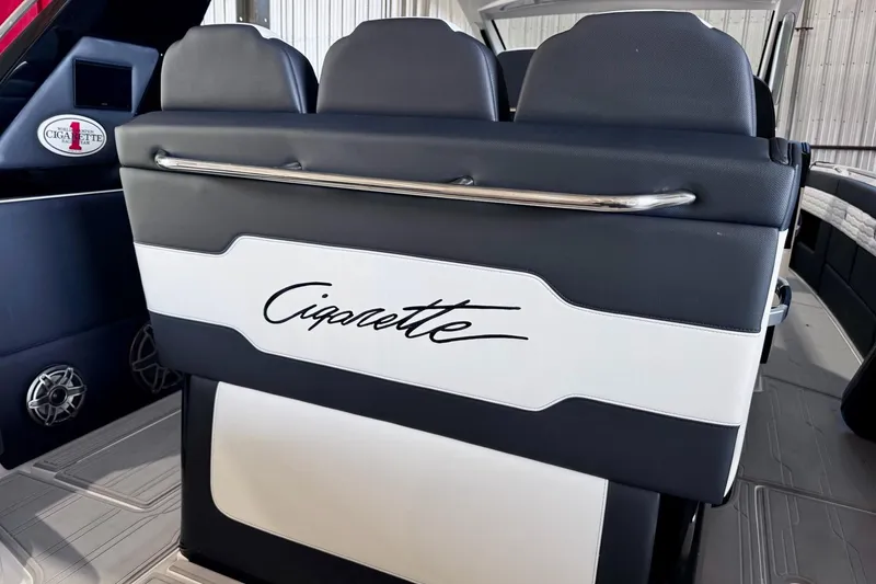 Slide: The Image of 2025 Cigarette 42' Auroris boat interior with sleek seating and branded logo. - 15
