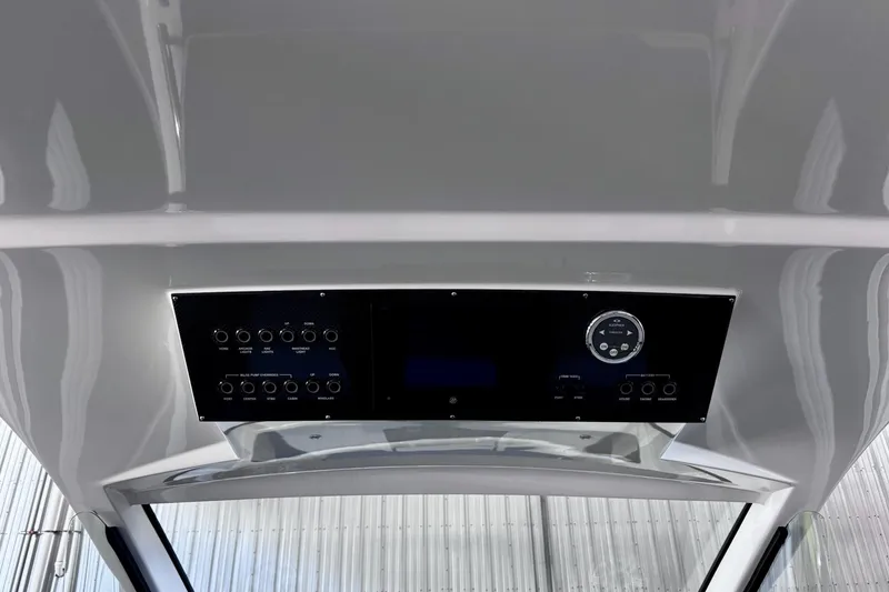 Slide: The Image of Control panel of 2025 Cigarette 42' Auroris boat, featuring modern switches and gauges. - 16