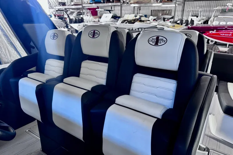Slide: The Image of Luxury seating in 2025 Cigarette 42' Auroris boat, featuring sleek black and white design. - 17