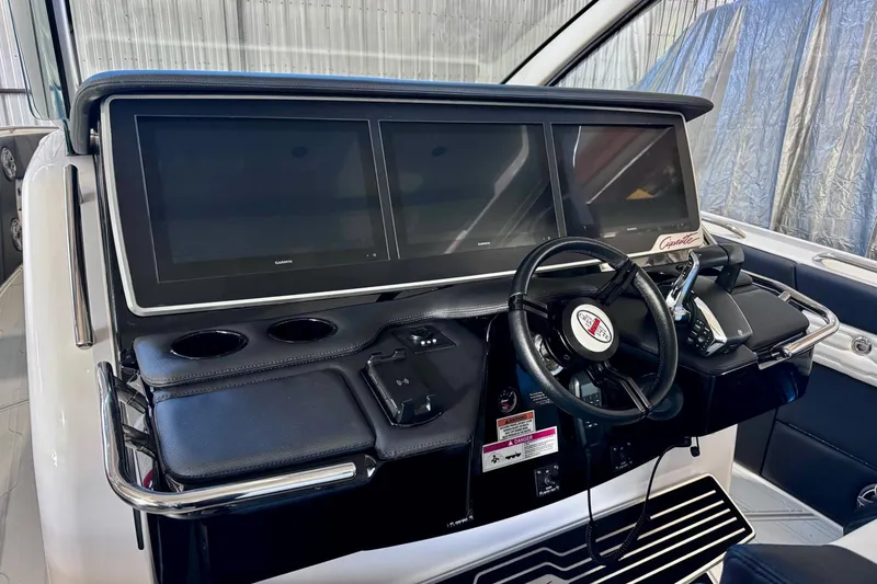 Slide: The Image of Helm of 2025 Cigarette 42' Auroris with advanced navigation screens and controls. - 18