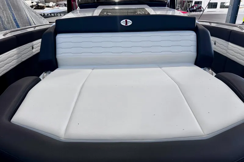 Slide: The Image of 2025 Cigarette 42' Auroris boat interior with sleek white and black seating. - 23