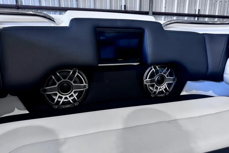 Slide: The Image of Interior of 2025 Cigarette 42' Auroris with speakers and screen, showcasing luxury design. - 26