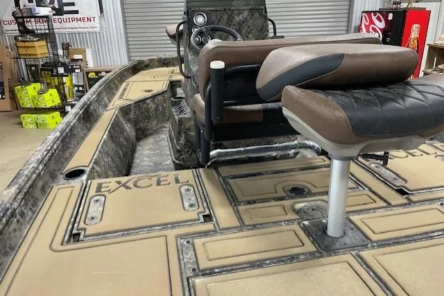 The Image of 2026 Excel 203 Bay Pro Elite boat interior with camo design and seating. - 1