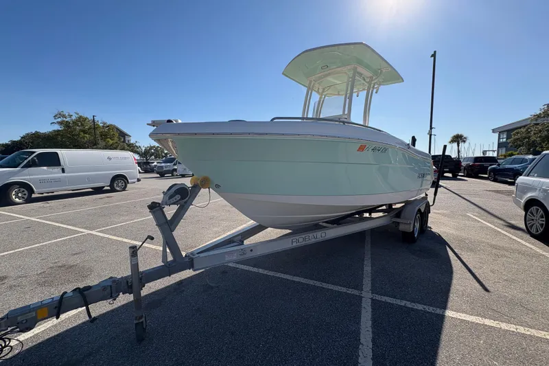 Slide: The Image of 2017 Robalo R222 boat on trailer in sunny parking lot. - 14