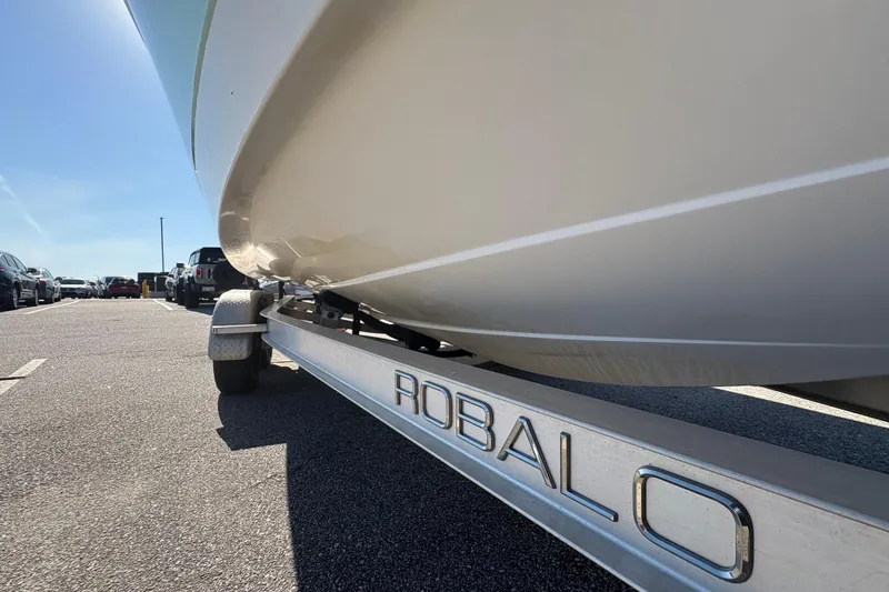 Slide: The Image of 2017 Robalo R222 boat on trailer in parking lot, sunny day. - 19