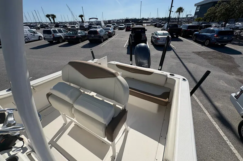 Slide: The Image of 2017 Robalo R222 Center Console boat interior with seating, on calm waters. - 8