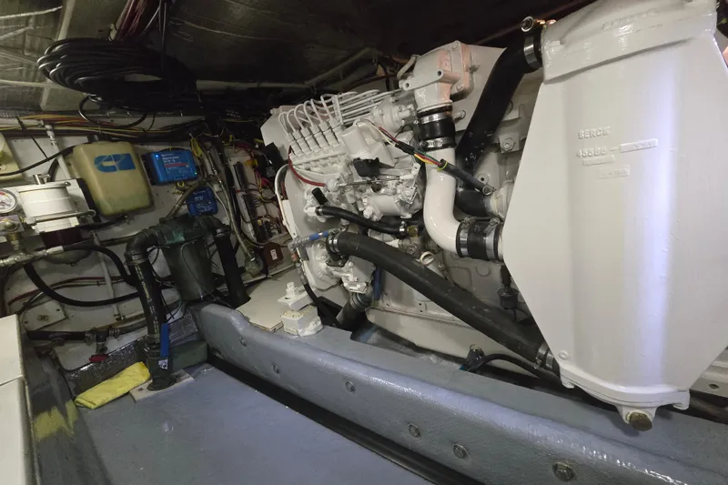 Slide: The Image of Engine room of a 2000 Nordic Tug 42 Flybridge, showcasing mechanical components. - 38