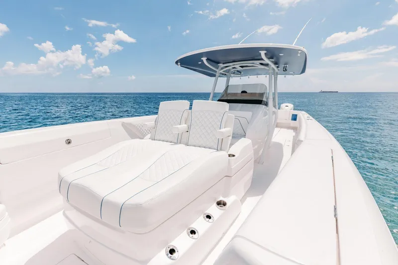 Slide: The Image of Manufacturer Provided Image: 2022 Intrepid 407 Nomad FE boat on open water, featuring luxurious seating. - 11