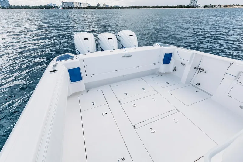 Slide: The Image of Manufacturer Provided Image: 2022 Intrepid 407 Nomad FE boat with triple outboard engines on open water. - 18