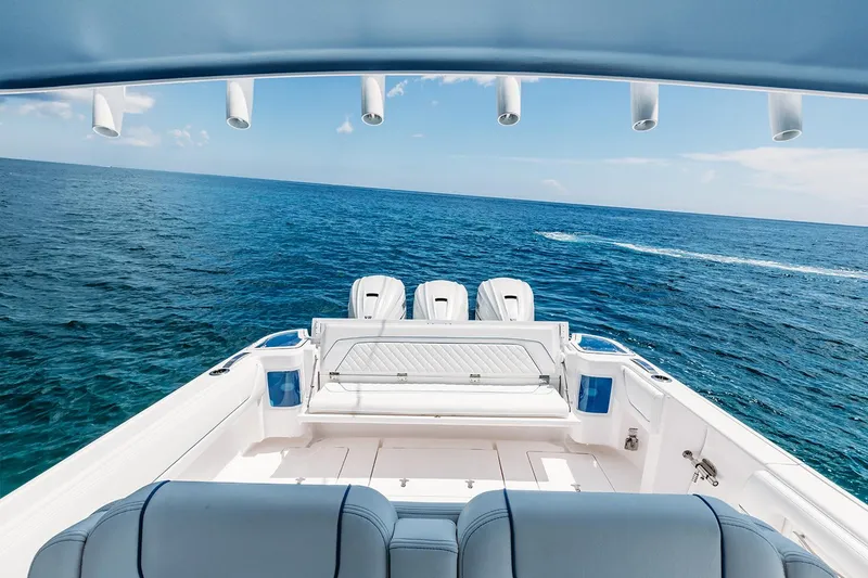 Slide: The Image of Manufacturer Provided Image: 2022 Intrepid 407 Nomad FE boat with triple engines on open sea. - 19