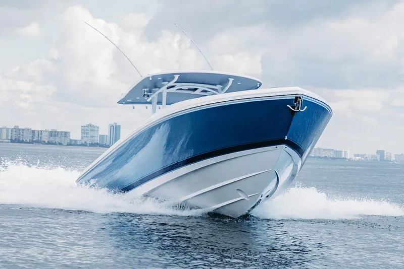 Slide: The Image of Manufacturer Provided Image: 2022 Intrepid 407 Nomad FE boat cruising on water. - 2