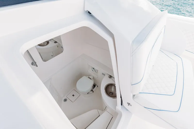 Slide: The Image of Manufacturer Provided Image: 2022 Intrepid 407 Nomad FE boat interior with toilet and sink. - 22
