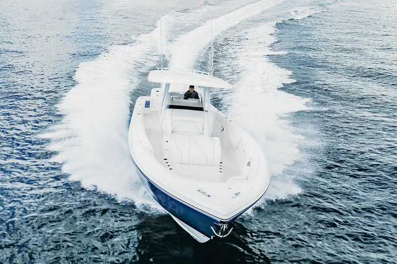Slide: The Image of Manufacturer Provided Image: 2022 Intrepid 407 Nomad FE boat cruising on open water. - 3