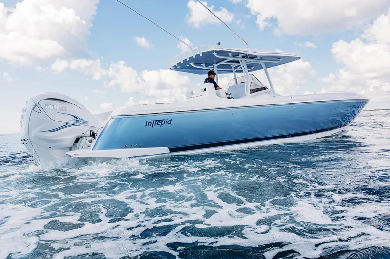 Slide: The Image of Manufacturer Provided Image: 2022 Intrepid 407 Nomad FE boat cruising on the ocean. - 5