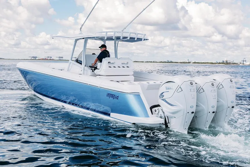 Slide: The Image of Manufacturer Provided Image: 2022 Intrepid 407 Nomad FE boat cruising on open water. - 6