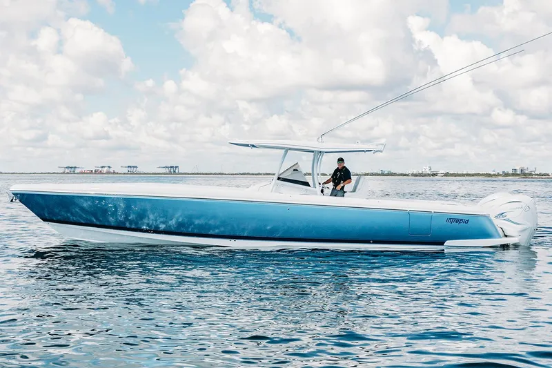 Slide: The Image of Manufacturer Provided Image: 2022 Intrepid 407 Nomad FE boat cruising on open water. - 7