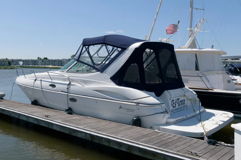 The Image of 2002 Cruisers Yachts 3275 Express docked at a marina. - 0