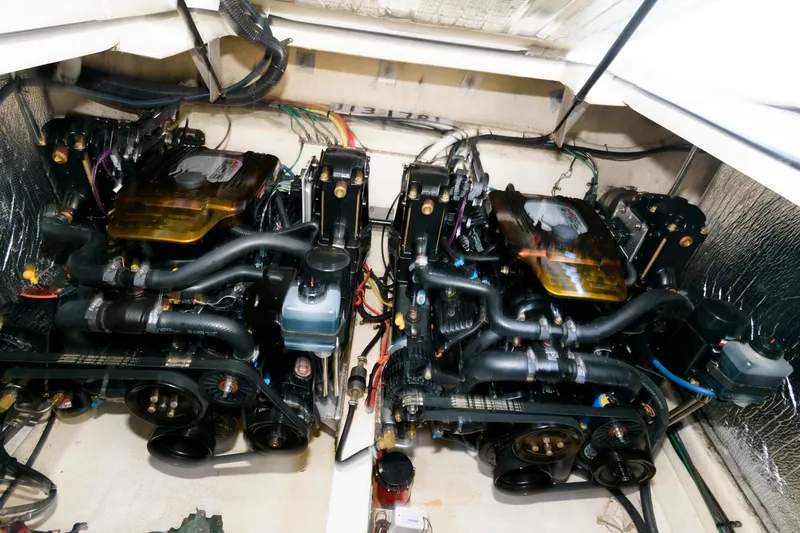 Slide: The Image of Twin engines of a 2002 Cruisers Yachts 3275 Express in the engine compartment. - 16